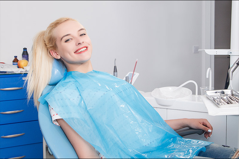 Very nice lady blonde hair relaxed in dental chair